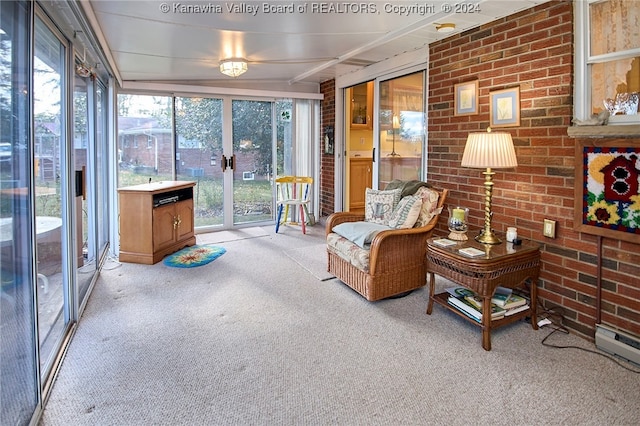 sunroom with a baseboard heating unit