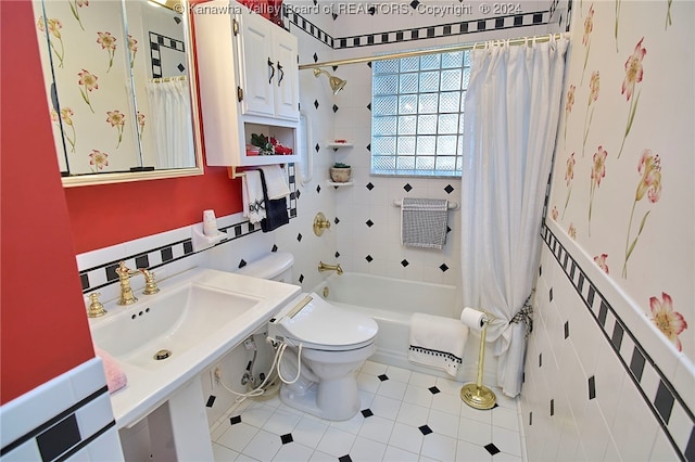 full bathroom featuring sink, tile patterned flooring, shower / bath combination with curtain, and toilet