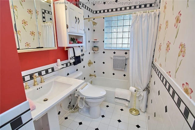 full bathroom featuring shower / tub combo with curtain, sink, tile patterned flooring, and toilet