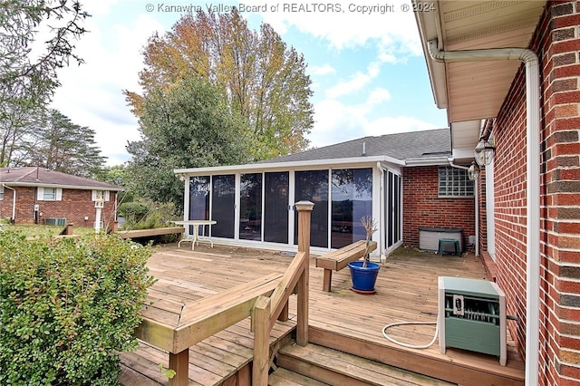 deck with a sunroom