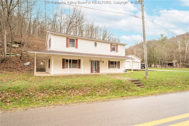 farmhouse with covered porch and a front yard