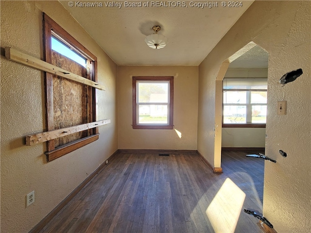 spare room featuring dark hardwood / wood-style floors