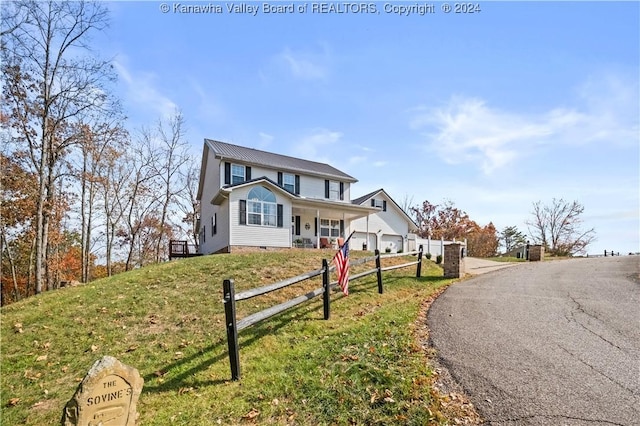 20 Poplar Hls, Hurricane, WV 25526 - traditional-style house with a metal roof and covered porch