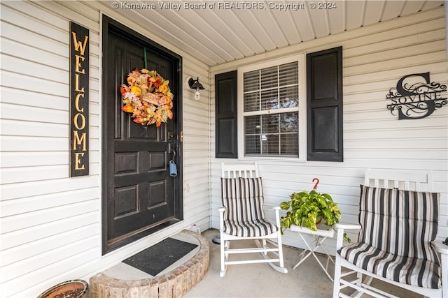 doorway to property featuring a porch