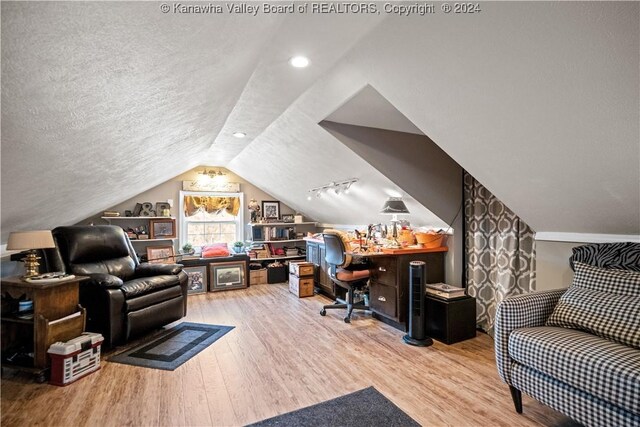 20 Poplar Hls, Hurricane, WV 25526 - office area featuring lofted ceiling, wood finished floors, and a textured ceiling