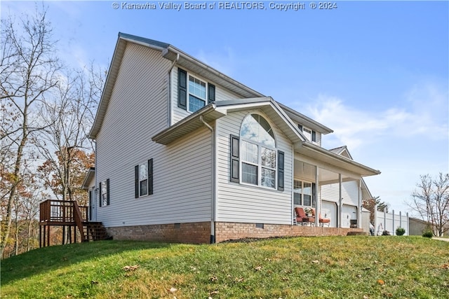 view of home's exterior featuring a yard and a porch