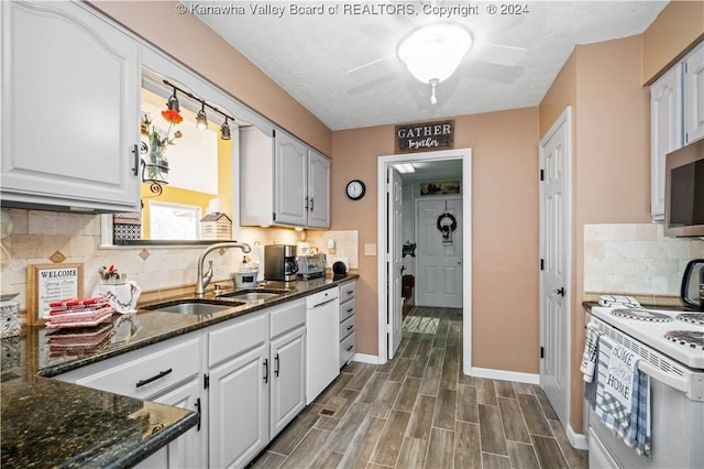 20 Poplar Hls, Hurricane, WV 25526 - kitchen featuring ceiling fan, white appliances, dark stone countertops, backsplash, and dark wood-style floors
