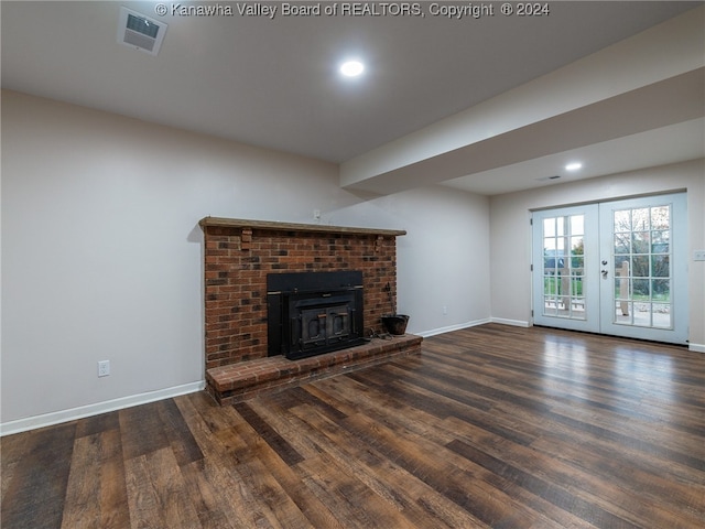 unfurnished living room with french doors and dark hardwood / wood-style flooring