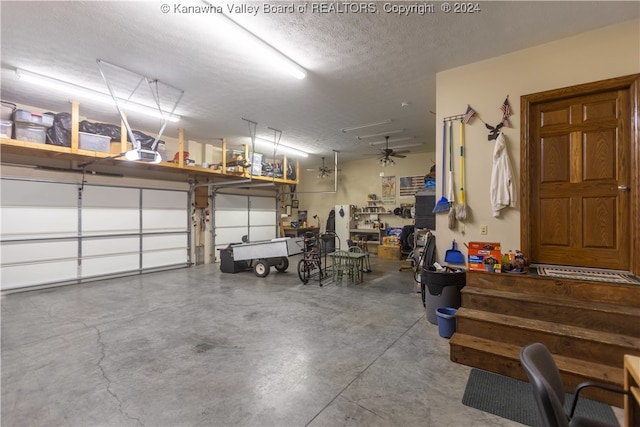 garage with ceiling fan and a garage door opener