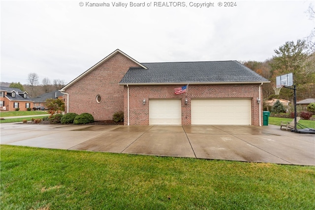 view of home's exterior featuring a yard and a garage