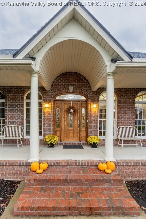 doorway to property with covered porch