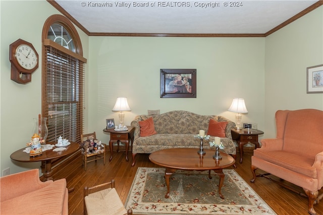 living room featuring hardwood / wood-style flooring and ornamental molding