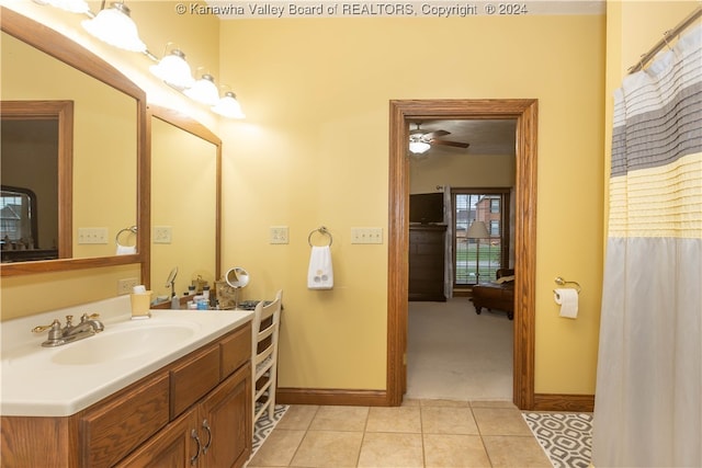 bathroom with tile patterned flooring, ceiling fan, and vanity