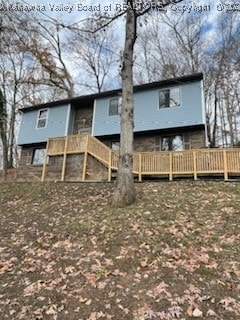 rear view of property with a deck