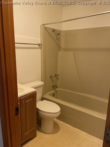 full bathroom featuring vanity, toilet, and bathtub / shower combination