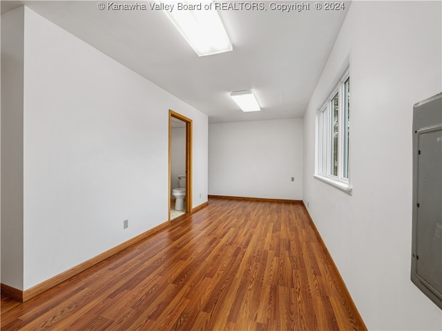 unfurnished room featuring wood-type flooring