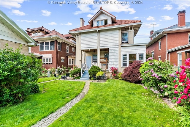 view of front of property with a front lawn