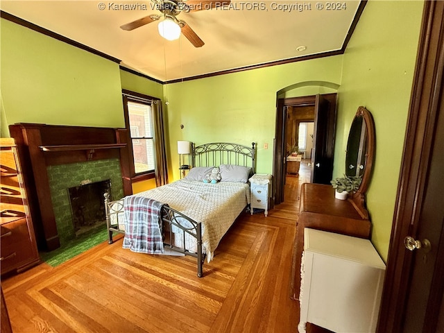 bedroom featuring ceiling fan, crown molding, and parquet floors