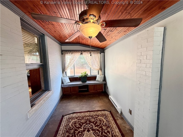 interior space with dark wood-type flooring, a baseboard heating unit, crown molding, lofted ceiling, and wood ceiling