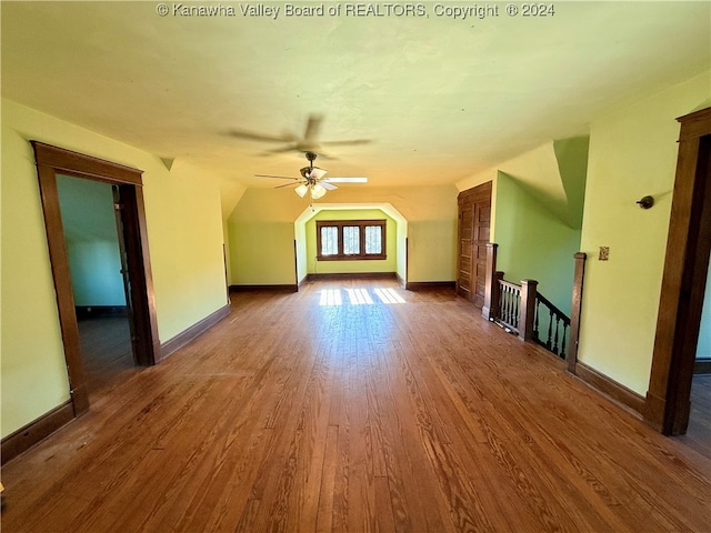 bonus room featuring hardwood / wood-style flooring, ceiling fan, and lofted ceiling