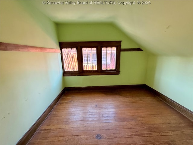 bonus room featuring hardwood / wood-style floors and lofted ceiling