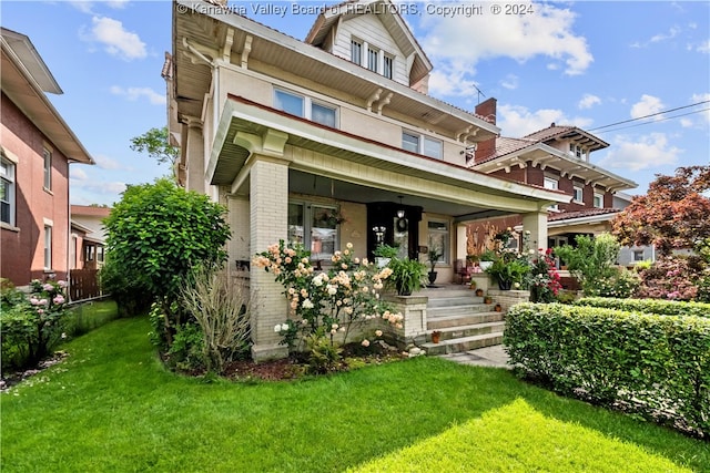 view of front of property featuring a porch and a front lawn