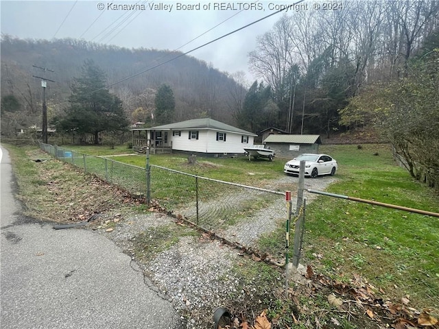 view of side of home featuring a lawn