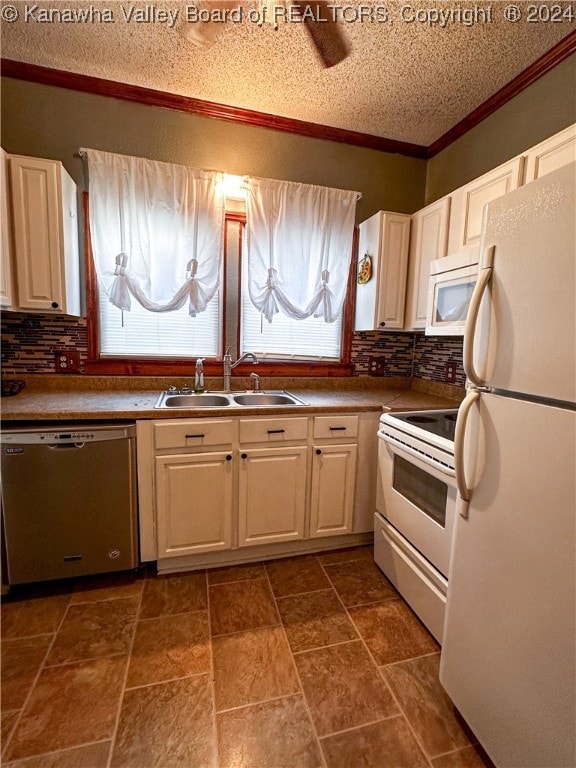 kitchen with tasteful backsplash, ornamental molding, a textured ceiling, white appliances, and sink