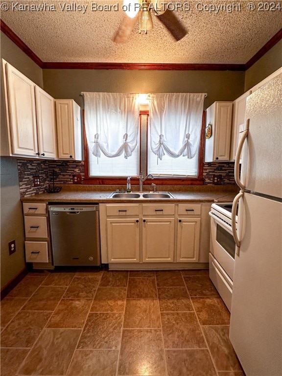 kitchen with a textured ceiling, white appliances, tasteful backsplash, and sink