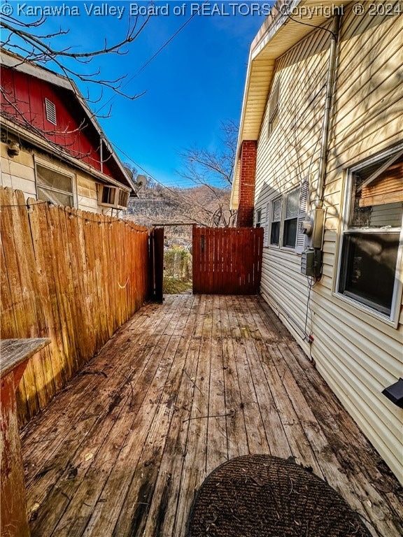 wooden deck with a mountain view