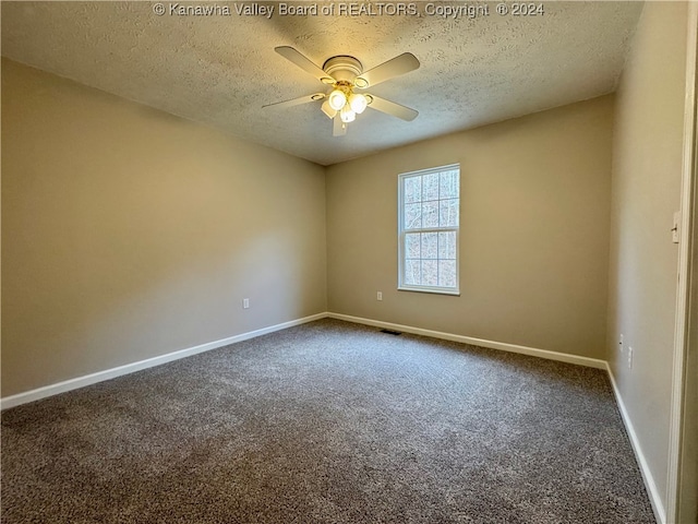 carpeted empty room with a textured ceiling and ceiling fan