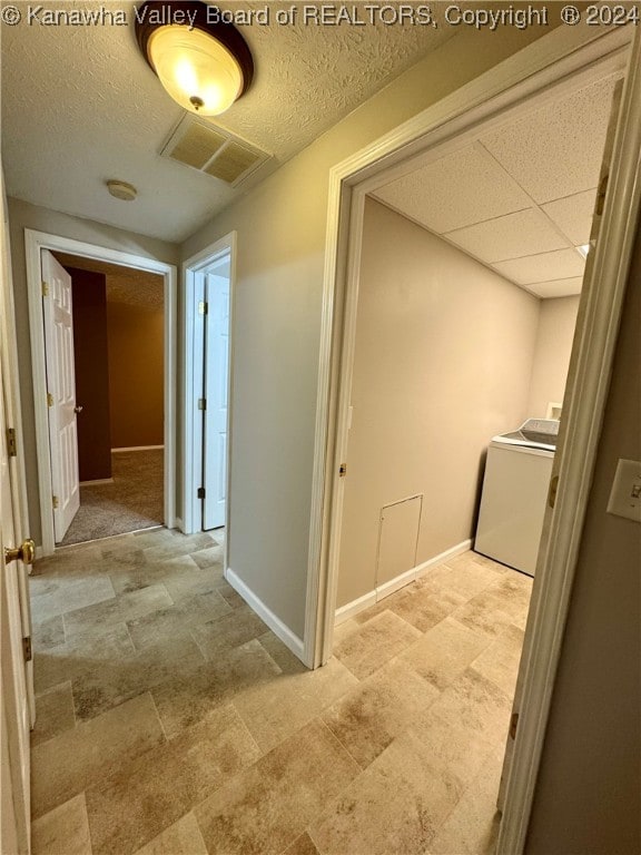 corridor with washer / dryer