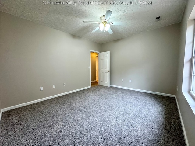 unfurnished room with carpet, a textured ceiling, and ceiling fan