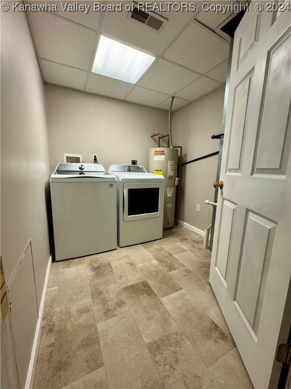 laundry room featuring electric water heater and washing machine and dryer