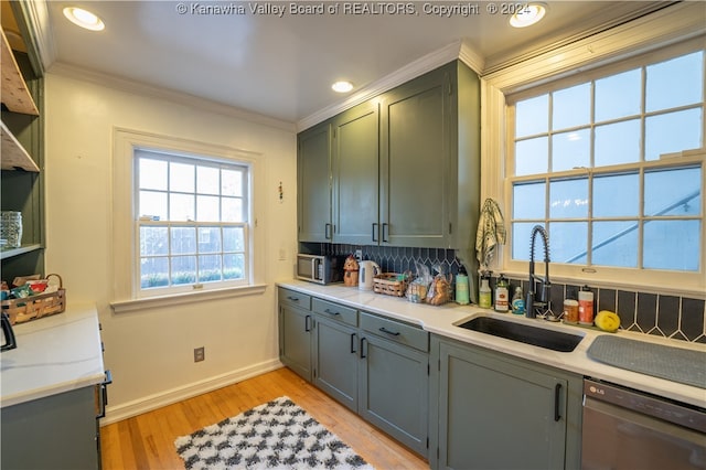 kitchen with dishwasher, backsplash, sink, light wood-type flooring, and ornamental molding