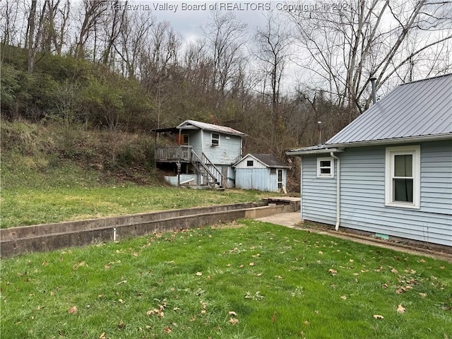 view of yard featuring a wooden deck