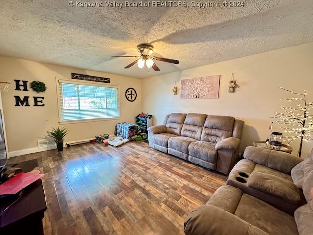 living room with hardwood / wood-style flooring, ceiling fan, and a textured ceiling