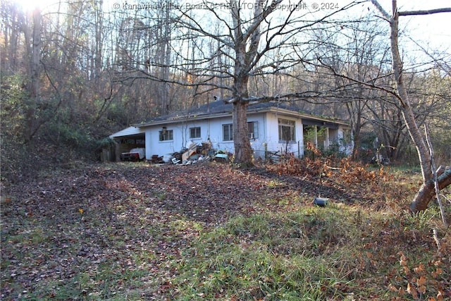 exterior space with a carport