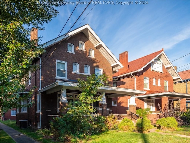 view of front of home with central AC and covered porch