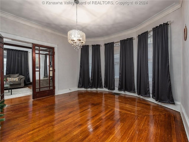1515 Lee St E, Charleston, WV 25311 - unfurnished room featuring crown molding, hardwood / wood-style floors, and a chandelier