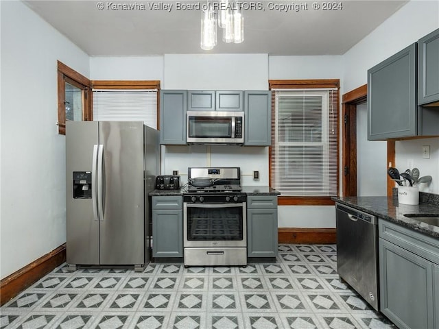 1515 Lee St E, Charleston, WV 25311 - kitchen featuring gray cabinetry, dark stone countertops, and appliances with stainless steel finishes