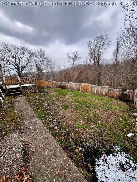 view of yard with a wooden deck