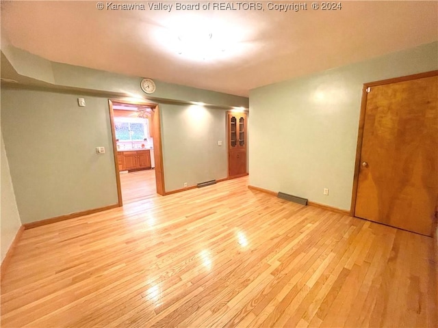 unfurnished room featuring light hardwood / wood-style floors