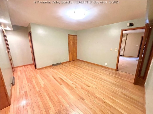 unfurnished room featuring light wood-type flooring