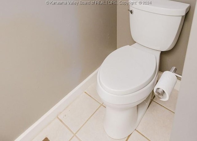 bathroom with tile patterned floors and toilet