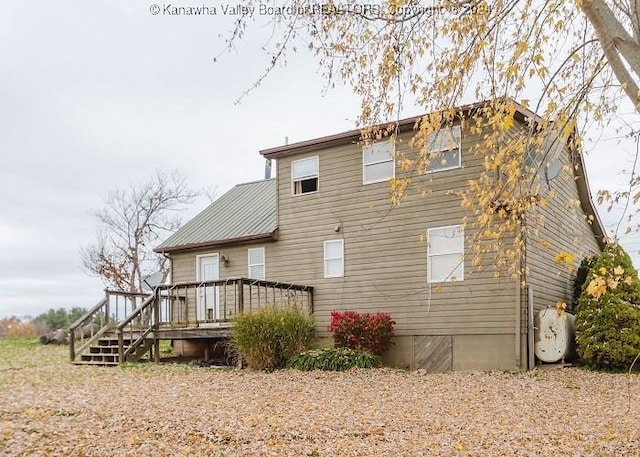 rear view of house with a deck