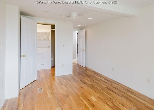 unfurnished bedroom featuring ceiling fan and light hardwood / wood-style floors