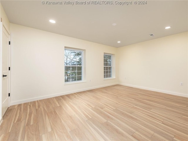 unfurnished room featuring light hardwood / wood-style floors