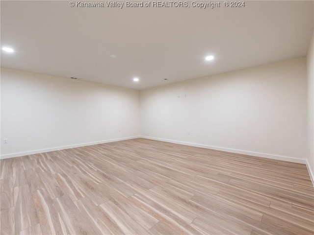 empty room with light hardwood / wood-style floors