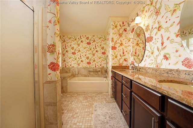 bathroom with a bathing tub, vanity, tile patterned floors, and crown molding